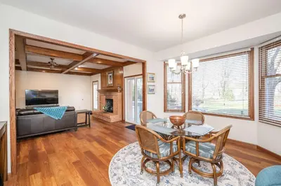 a living room with a table and chairs and a television at Luxurious Dream Home - For 10 in Loveland