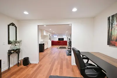 a living room with a red couch and a table at Luxurious Dream Home - For 10 in Loveland