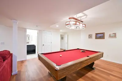 a living room with a red pool table at Luxurious Dream Home - For 10 in Loveland