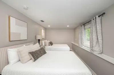 a bedroom with two beds and a window at Poolside Paradise Near the Ark in Walton