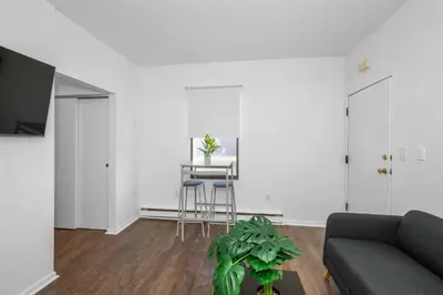 a living room with a couch and a table at Northside Suites 1 - Best Retreat for Couples in Cincinnati