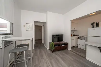 a kitchen with white appliances and a counter top at Northside Suite 2 - Cozy Escape in Cincinnati