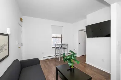a living room with a couch and a table at Northside Suites 4 - Your Perfect Vacation Haven in Cincinnati