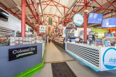 a grocery store aisle with a colocalidated counter at Findlay Market Suite 1 - For 2 in Cincinnati