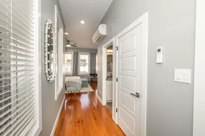 a hallway with white walls and a white door at Findlay Market Suite 2 - For 2 in Cincinnati