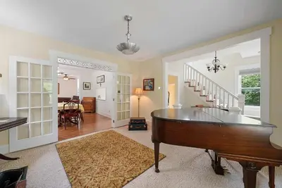 a living room with a ping pong table in it at Classic Charm on Ashland - For 8 in Columbus