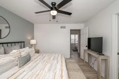 a bedroom with a bed and a ceiling fan at Walton Arkside Oasis in Walton