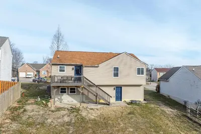 a white house with a staircase in a yard at Walton Arkside Oasis in Walton