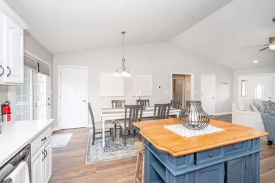 a kitchen and living room with a table and chairs at Crittenden Ark Haven in Crittenden