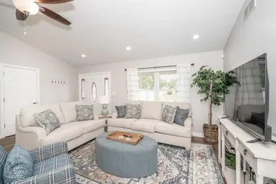 a living room with a couch and a tv at Crittenden Ark Haven in Crittenden