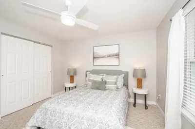 a bedroom with a bed and a ceiling fan at Crittenden Ark Haven in Crittenden