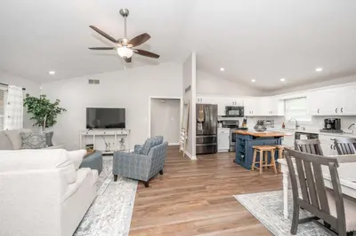 a living room with a couch and a ceiling fan at Crittenden Ark Haven in Crittenden