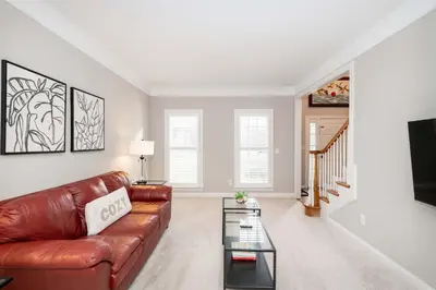 a living room with a brown leather couch at Mason Oasis 5 BDR Home Sweet Home Family-Friendly in Mason