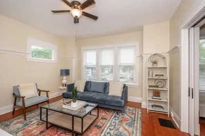 a living room with a couch and a table at The Cincinnati Cottage in Cincinnati