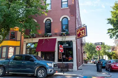 a truck parked on a street in front of a building at Heart of Mainstrasse 1 in Covington