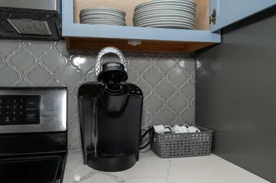 a kitchen counter with a blender on a counter top at Heart of Mainstrasse 3 in Covington