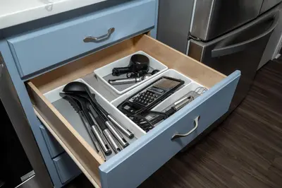 a drawer filled with utensils in a kitchen at Heart of Mainstrasse 3 in Covington