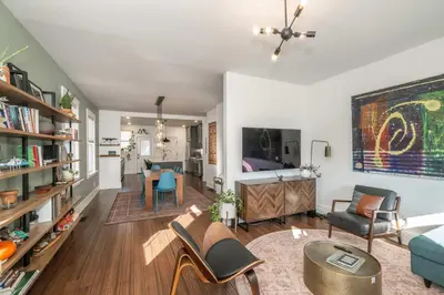 a living room with a couch and a bed at Northside Nook Home for 6 in Cincinnati