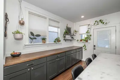 a kitchen with a counter with plants on the wall at Northside Nook Home for 6 in Cincinnati