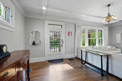a living room with a couch and a table at Urban Elegance Getaway in Columbus