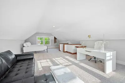 a living room with a couch and a desk at Urban Elegance Getaway in Columbus
