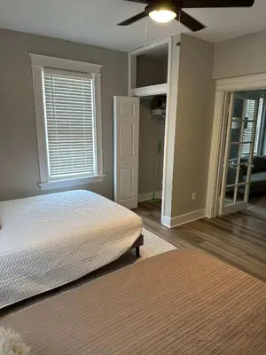a bedroom with a bed and a ceiling fan at LUXE Spot 2 in Covington