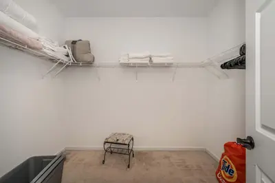 a room with a chair and towels on a wall at Urban Escape in Cincinnati