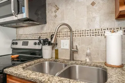 a kitchen with a sink and a stove at Cozy Home Away From Home in Florence