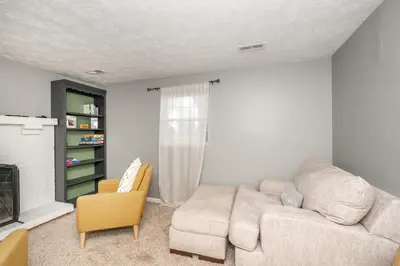 a living room with a couch and a chair at Cozy Home Away From Home in Florence