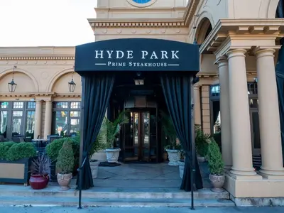 a building with a sign that reads hyde park fame staratown at North Pearl Residences 874 in Columbus