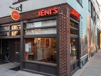 a store front of a brick building with a sign on it at North Pearl Residences 874 in Columbus
