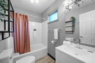 a bathroom with a sink and a toilet and a tub at North Pearl Residences 874 in Columbus