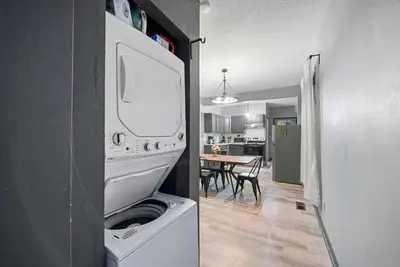a washer and dryer in a room with a kitchen at North Pearl Residences 874 in Columbus