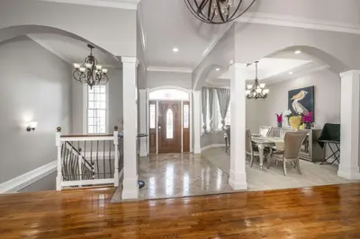 a dining room and living room with a dining table at The Bishops Manor Stay for 10 in West Chester