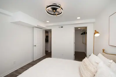a bedroom with a bed and a ceiling fan at Covington Charm 101 in Covington