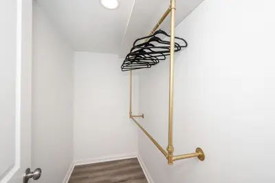 a towel rack in a room with a white wall at Covington Charm 101 in Covington