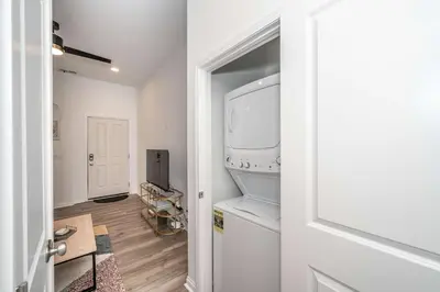 a kitchen with a washer and dryer in a room at New Listing - Covington Charm Suites in Covington