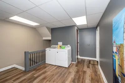 a laundry room with a washer and dryer at New Monmouth Loft 1 - City Chic 1 BDR in Newport