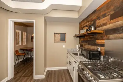 a kitchen with a stove and a counter top at Monmouth Loft 3 - Heart of Newport in Newport