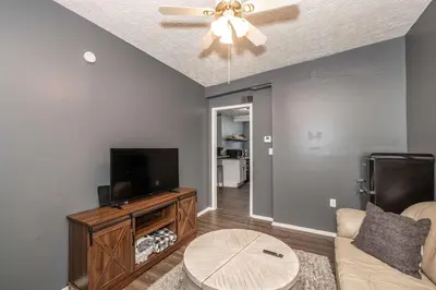 a living room with a couch and a tv at Monmouth Loft 4 - Walk to Shops in Newport