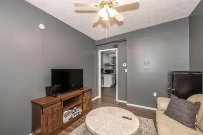 a living room with a couch and a flat screen tv at Monmouth Lofts - Newport Lofts Sleep 10 in Newport