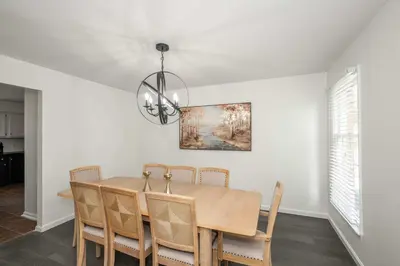 a dining room with a table and chairs at Lark Meadow Retreat Sleeps 10 in Mason