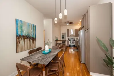 a dining room and kitchen with a table and chairs at Cityscape Escape - Local Eateries in Cincinnati