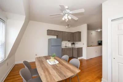 a kitchen and dining room with a table and chairs at Cityscape Escape - Local Eateries in Cincinnati
