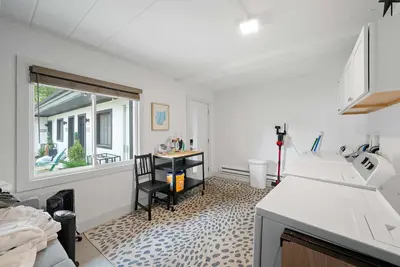 a kitchen with a sink and a table and a window at Chic City Retreat 89 For 2 in Columbus
