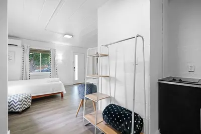 a bedroom with a bed and a ladder in a room at Chic City Retreat 87 in Columbus