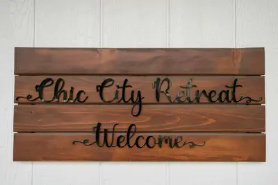 a sign that reads the thy kitchen is welcome at Chic City Retreat 93E in Columbus