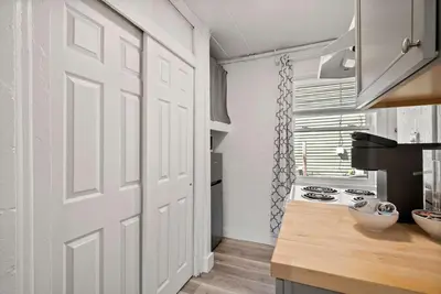 a white door in a kitchen with a stove at Chic City Retreat 93F in Columbus