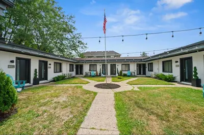 a house with an american flag in the yard at Chic City Retreat 93G in Columbus