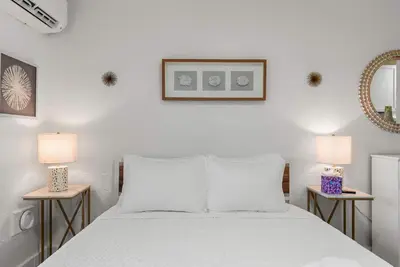 a bedroom with a white bed with two lamps at Chic City Retreat 93J For 2 in Columbus